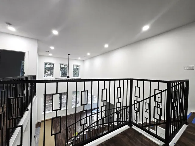 a view of staircase with lots of wooden floor
