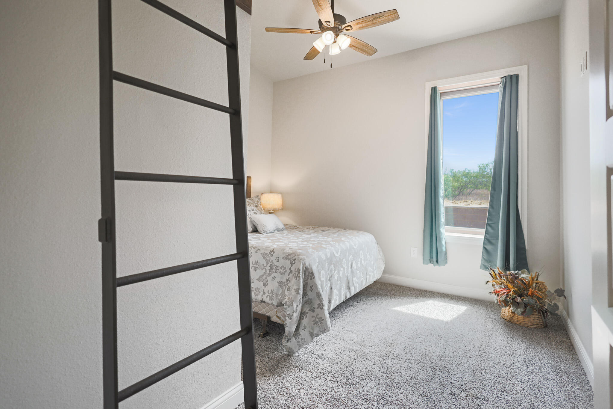 301 Fagan Road Snyder, TX 79549 - Photo 62 of 102 a bedroom with a bed and a chandelier