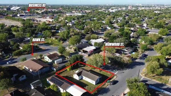 an aerial view of residential houses with outdoor space