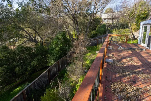a view of a house with backyard porch and sitting area