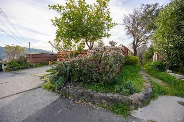 a view of a patio with a bench
