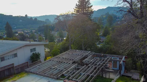 an aerial view of residential house and green space