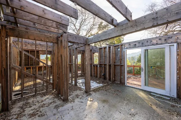 a view of a wooden house with a outdoor space