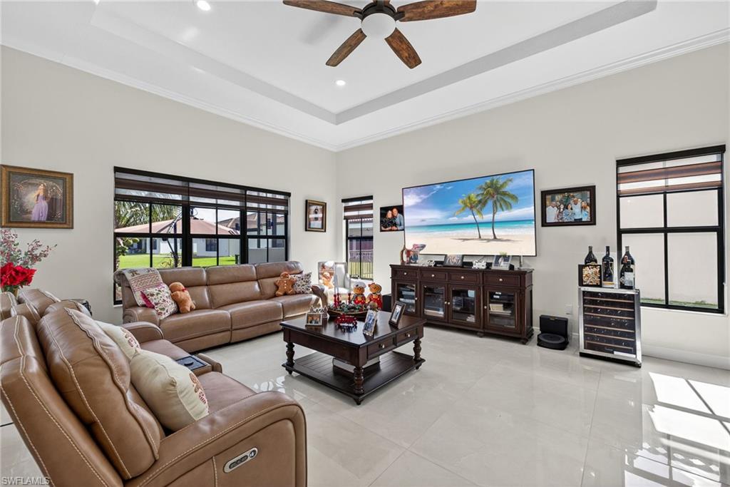 5102 Genoa Street Immokalee, FL 34142 - Photo 11 of 36 a living room with furniture and a flat screen tv