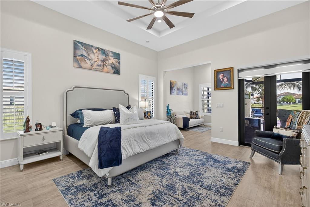 5102 Genoa Street Immokalee, FL 34142 - Photo 12 of 36 a bedroom with a large bed a rug and a window