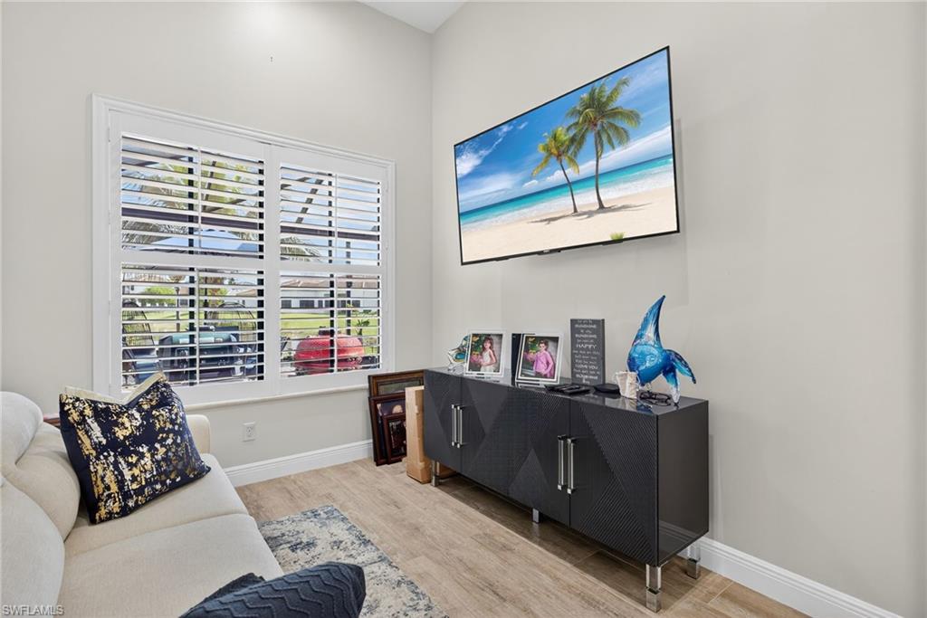 5102 Genoa Street Immokalee, FL 34142 - Photo 14 of 36 a living room with furniture and a window