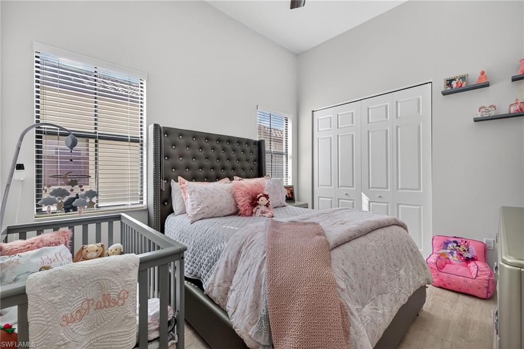 5102 Genoa Street Immokalee, FL 34142 - Photo 18 of 36 a bedroom with a bed and a window