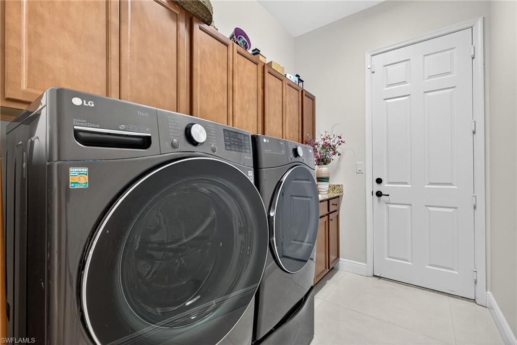 5102 Genoa Street Immokalee, FL 34142 - Photo 24 of 36 a utility room with dryer and washer