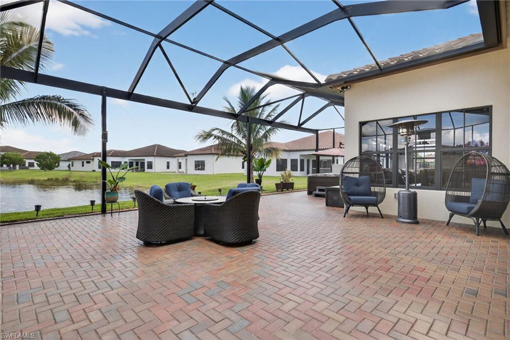 5102 Genoa Street Immokalee, FL 34142 - Photo 27 of 36 a view of swimming pool with outdoor seating and plants