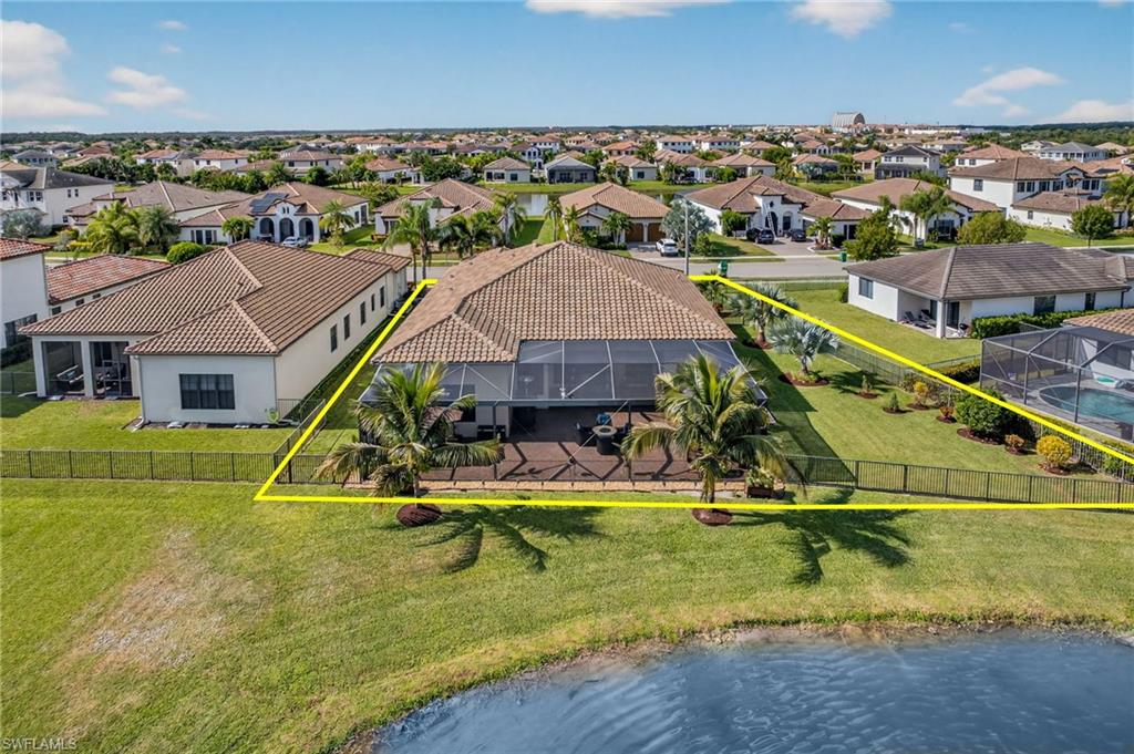 5102 Genoa Street Immokalee, FL 34142 - Photo 34 of 36 an aerial view of a house with swimming pool