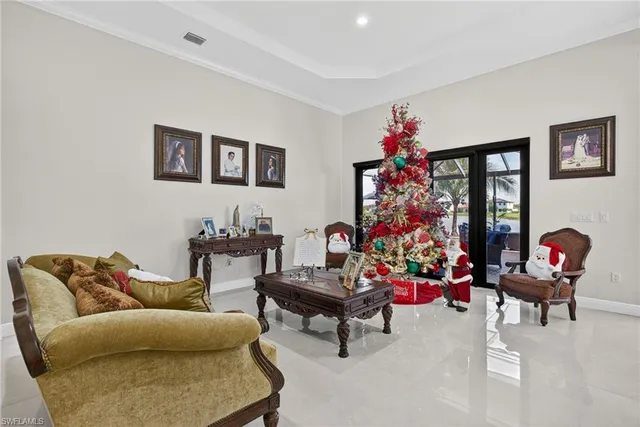 a living room with furniture and a potted plant