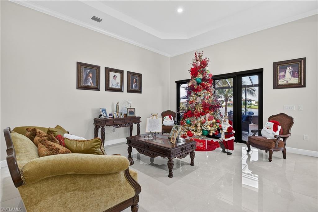 5102 Genoa Street Immokalee, FL 34142 - Photo 4 of 36 a living room with furniture and a potted plant