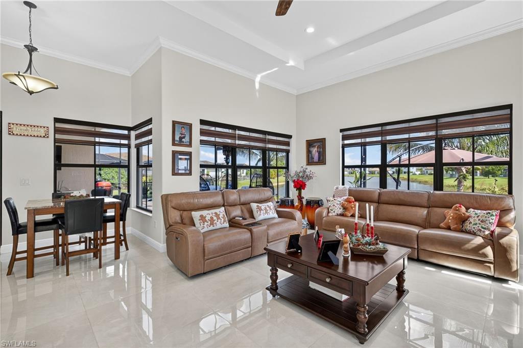 5102 Genoa Street Immokalee, FL 34142 - Photo 10 of 36 a living room with furniture and a large window