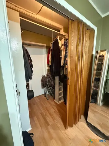 a view of balcony with wooden floor and fence