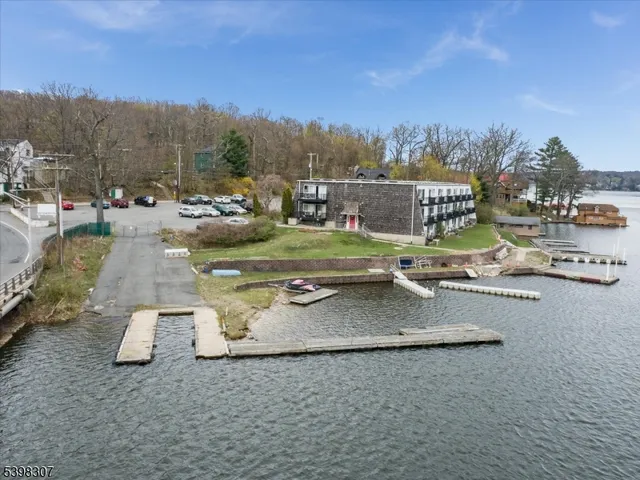 a view of a swimming pool and trees in the background