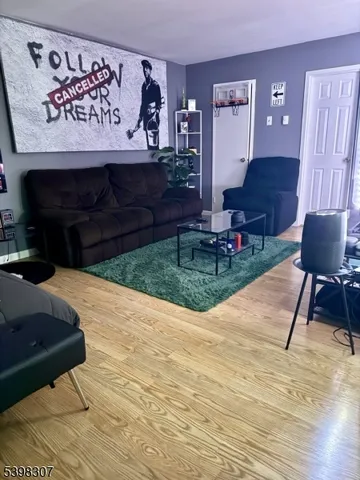 a view of living room kitchen with a table and chair
