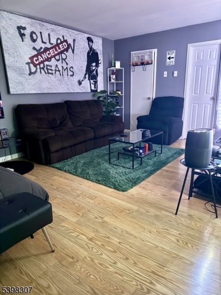 469 River Styx Road, Unit 25 Hopatcong, NJ 07843 - Photo 2 of 8 a view of living room kitchen with a table and chair