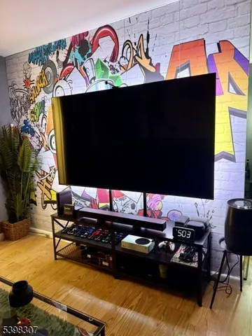 a room with furniture and flat screen tv