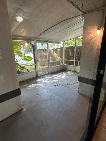 a view of empty room with floor to ceiling window