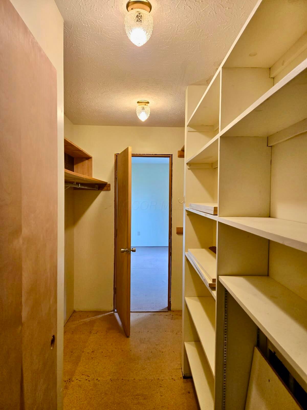 13480 Robins Road Westerville, OH 43082 - Photo 24 of 46 Closet between primary bedroom and first floor laundry.