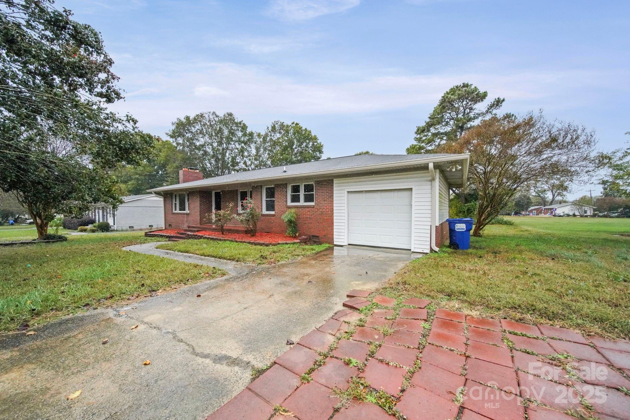 1331 Stegall Road Marshville, NC 28103 - Photo 1 of 35 a view of a yard in front of a house with large tree