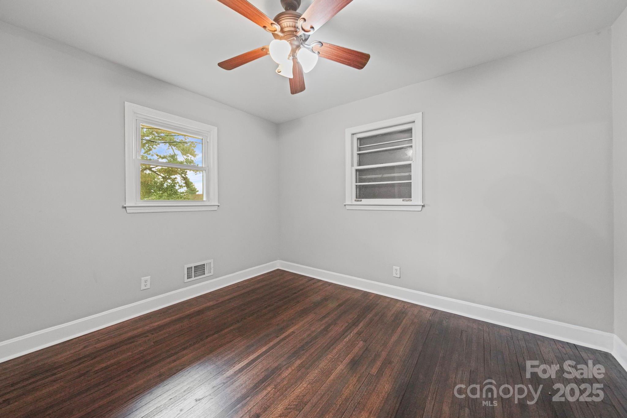 1331 Stegall Road Marshville, NC 28103 - Photo 23 of 35 a view of an empty room with wooden floor and a window