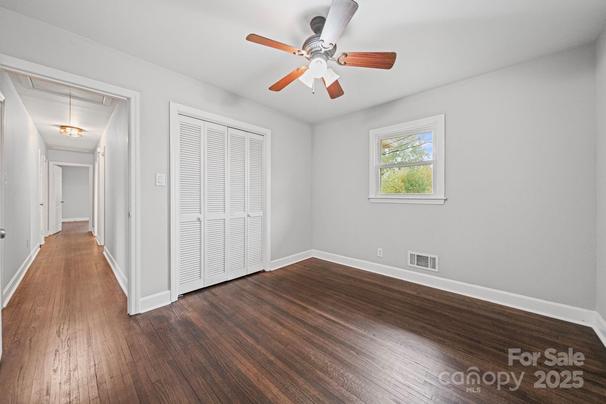 1331 Stegall Road Marshville, NC 28103 - Photo 24 of 35 wooden floor in an empty room with a window