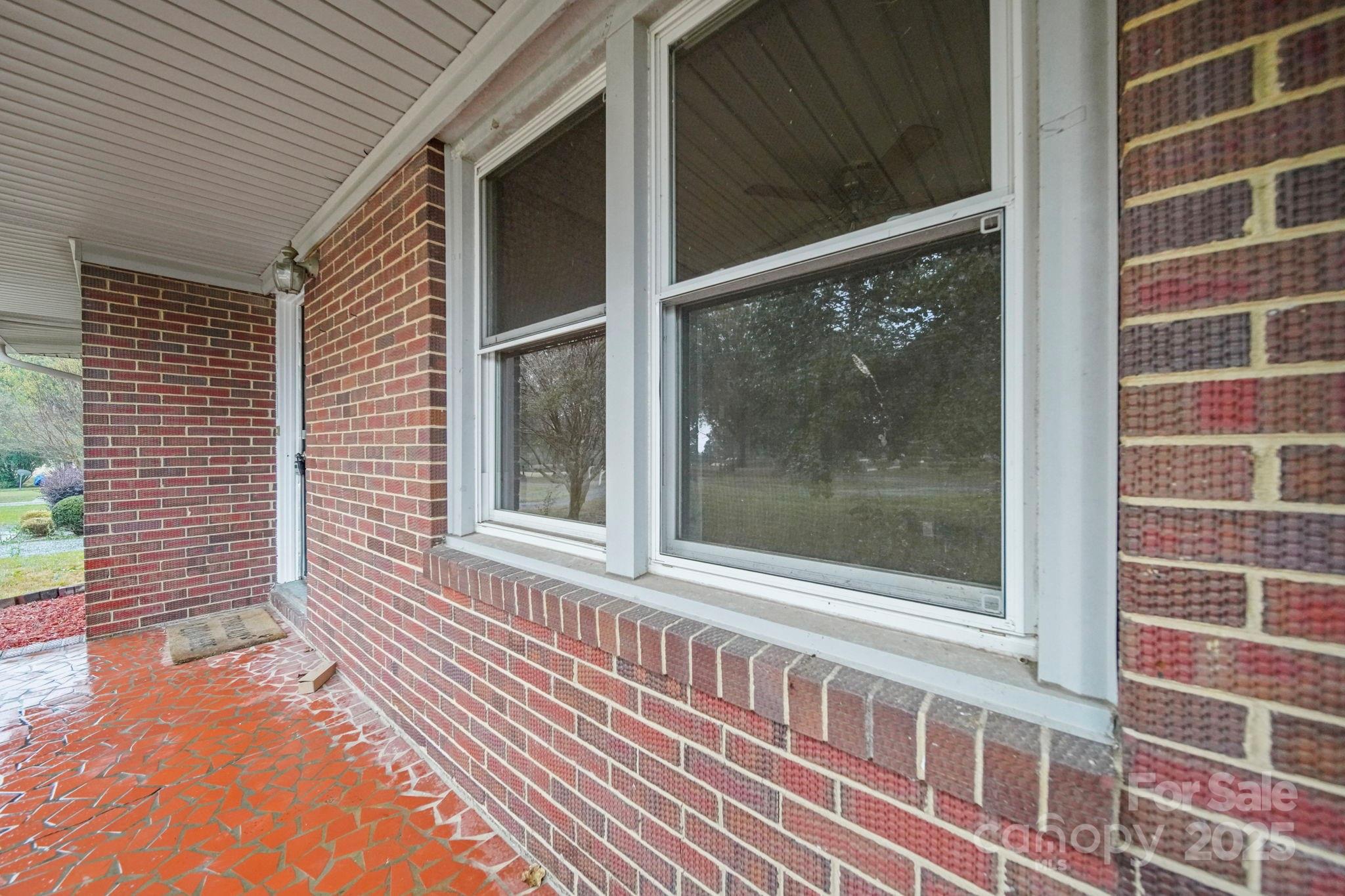 1331 Stegall Road Marshville, NC 28103 - Photo 27 of 35 a view of a brick house with a large window