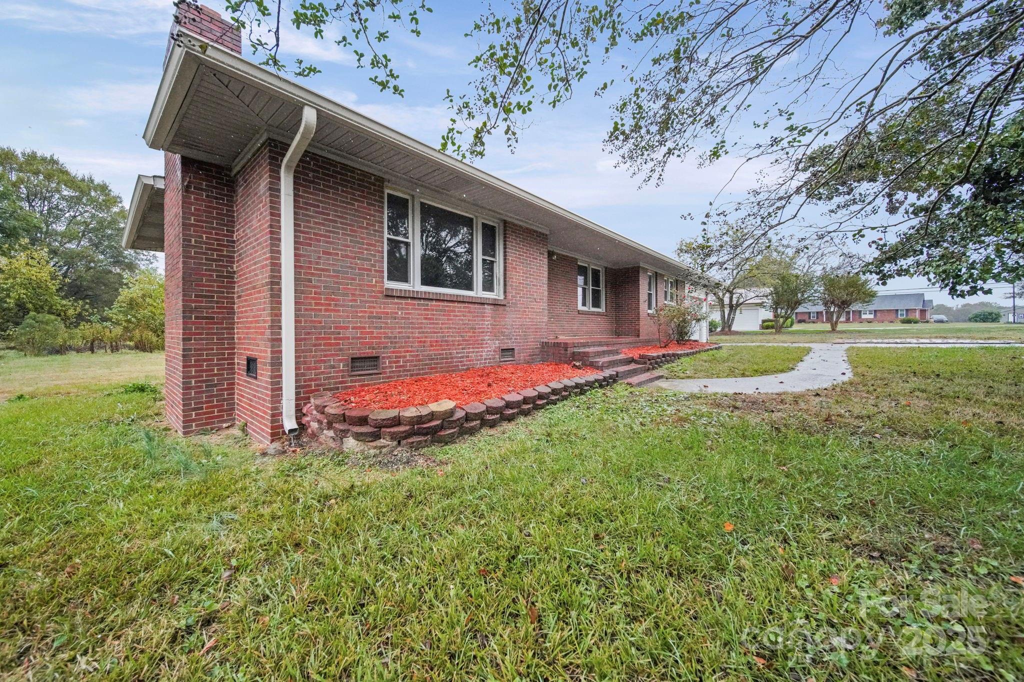 1331 Stegall Road Marshville, NC 28103 - Photo 29 of 35 a view of a house with backyard and sitting area