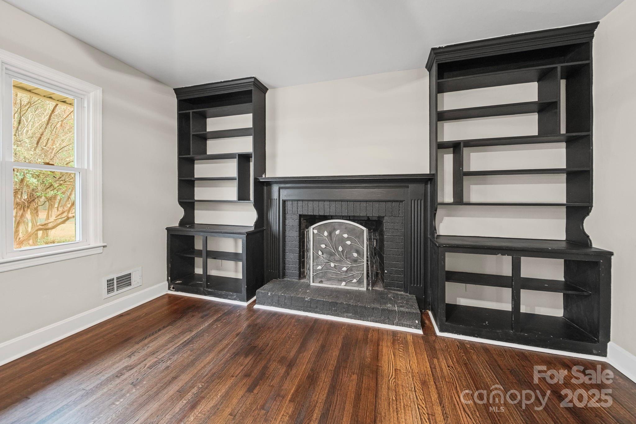 1331 Stegall Road Marshville, NC 28103 - Photo 3 of 35 a view of empty room with wooden floor and fan