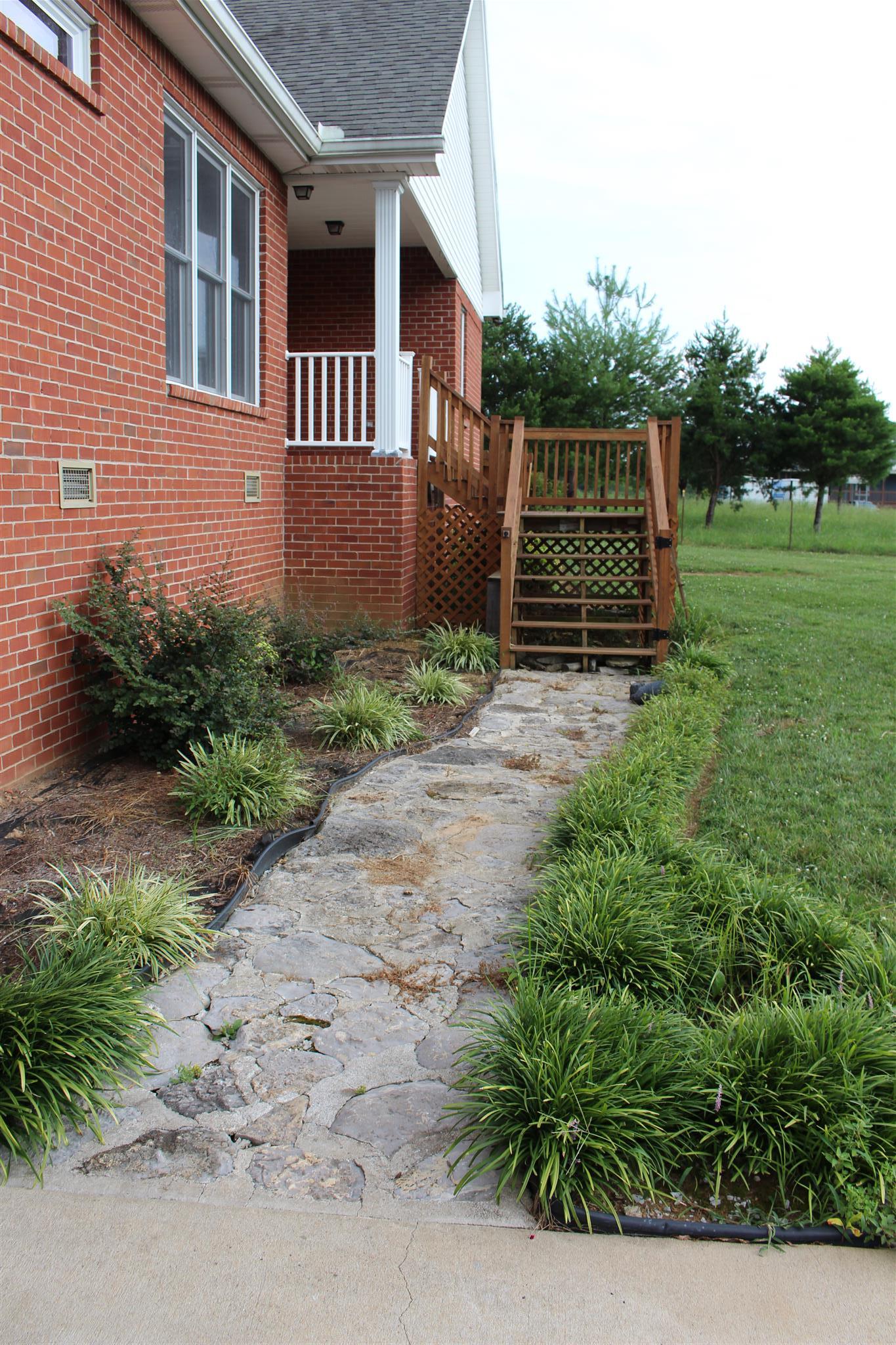 112 Big Springs Road Lebanon, TN 37087 - Photo 23 of 29 a backyard of a house with lots of green space