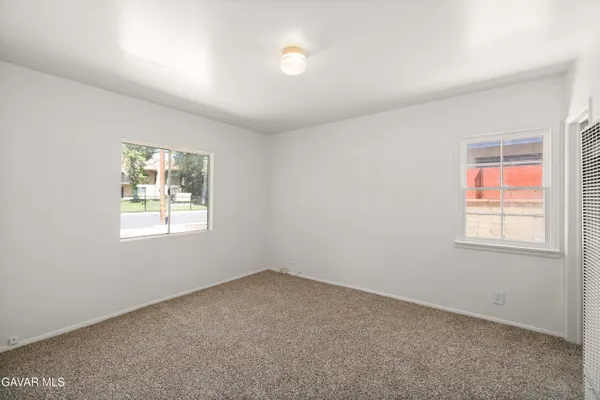 a room with furniture a washer and dryer