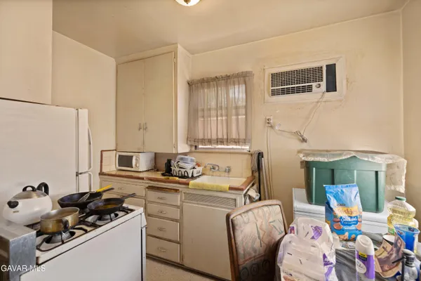 a kitchen with stainless steel appliances granite countertop a stove and a refrigerator