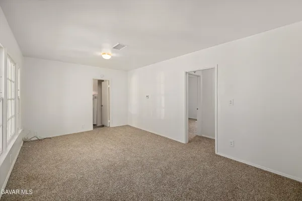 a bedroom with furniture and a chandelier