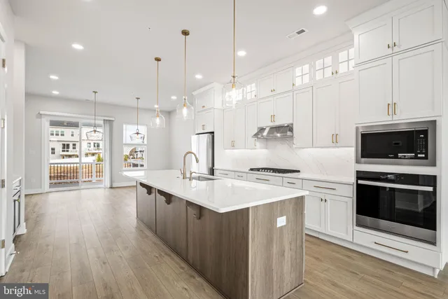 a kitchen with a sink and stove