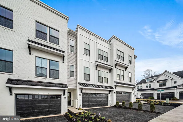 a front view of a building with many windows