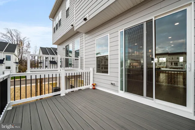a view of a deck with wooden floor and fence