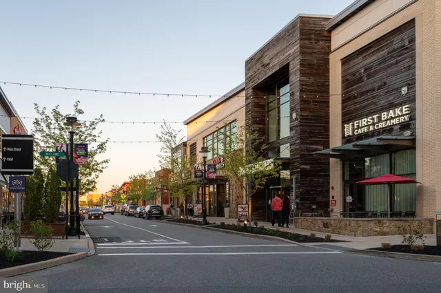 a view of street with shops on a street