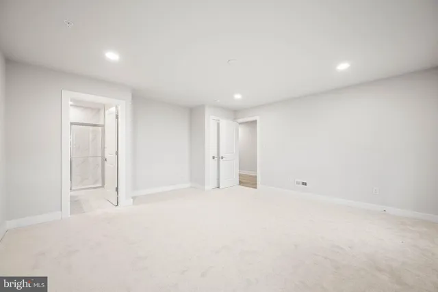 a bathroom with a sink toilet a mirror and shower