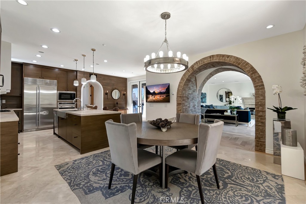 16 Eucalyptus Newport Coast, CA 92657 - Photo 15 of 38 a view of a dining room with furniture a rug and wooden floor
