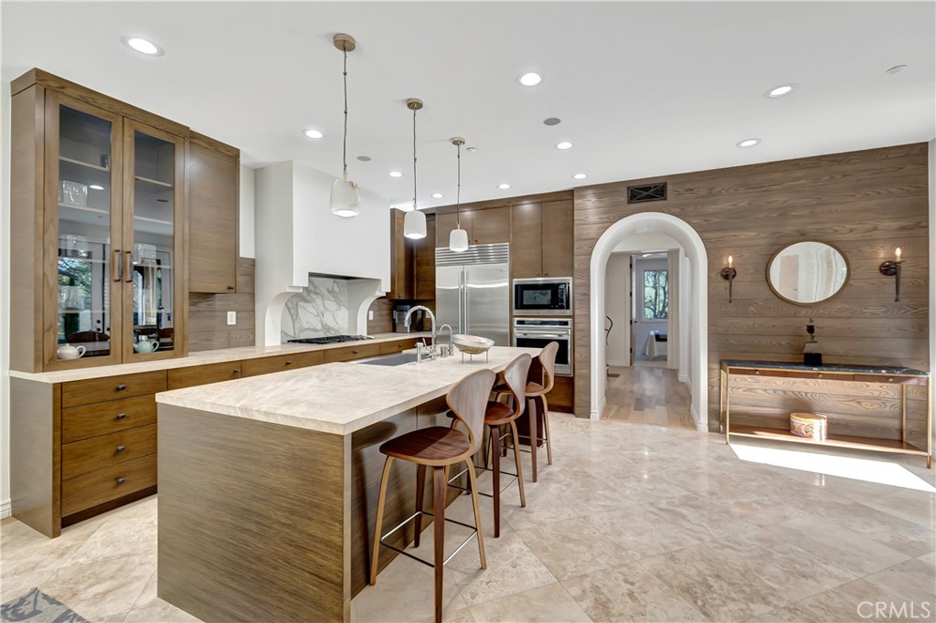 16 Eucalyptus Newport Coast, CA 92657 - Photo 16 of 38 a large kitchen with a table and chairs