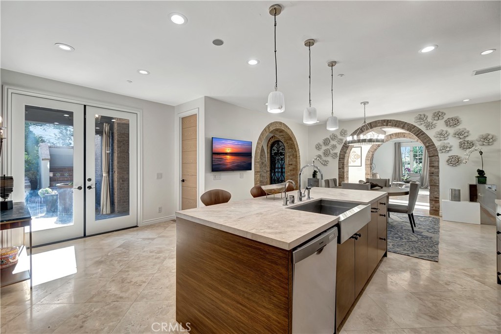 16 Eucalyptus Newport Coast, CA 92657 - Photo 18 of 38 a living room with stainless steel appliances kitchen island granite countertop furniture and a view of living room