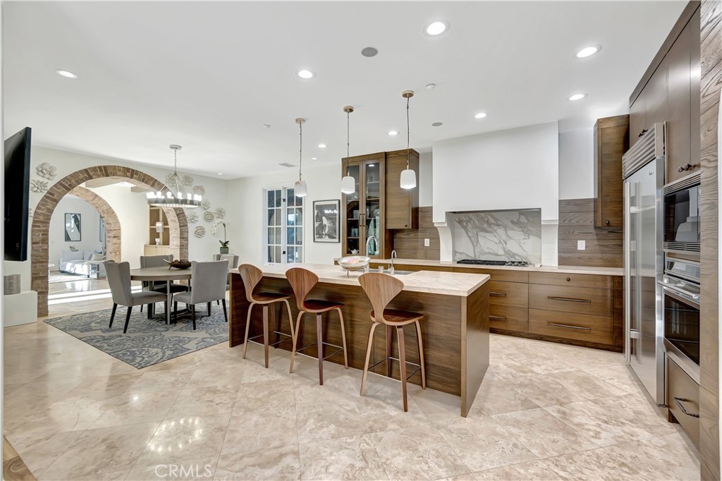 16 Eucalyptus Newport Coast, CA 92657 - Photo 19 of 38 a large kitchen with lots of counter space and furniture