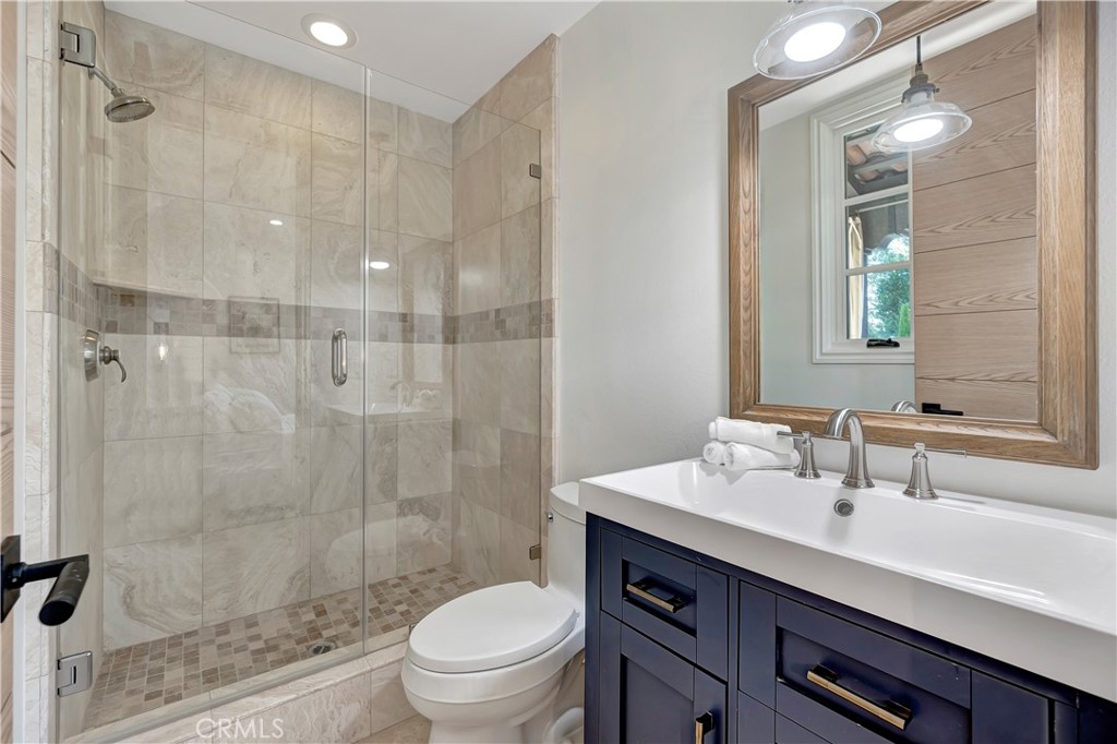 16 Eucalyptus Newport Coast, CA 92657 - Photo 23 of 38 a bathroom with a sink a toilet and shower
