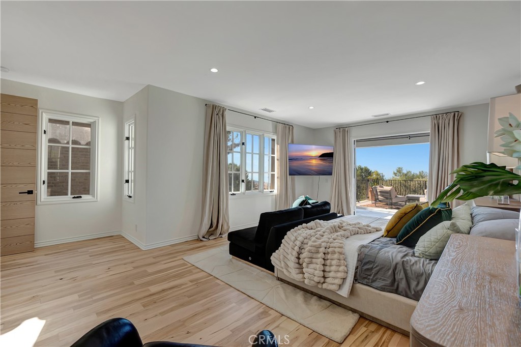 16 Eucalyptus Newport Coast, CA 92657 - Photo 30 of 38 a bedroom with a large bed and a large window