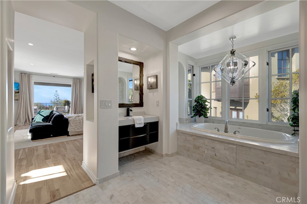 16 Eucalyptus Newport Coast, CA 92657 - Photo 32 of 38 a large en suite bathroom with a tub shower and mirror