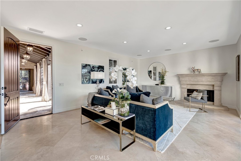 16 Eucalyptus Newport Coast, CA 92657 - Photo 8 of 38 a living room with furniture and a fireplace