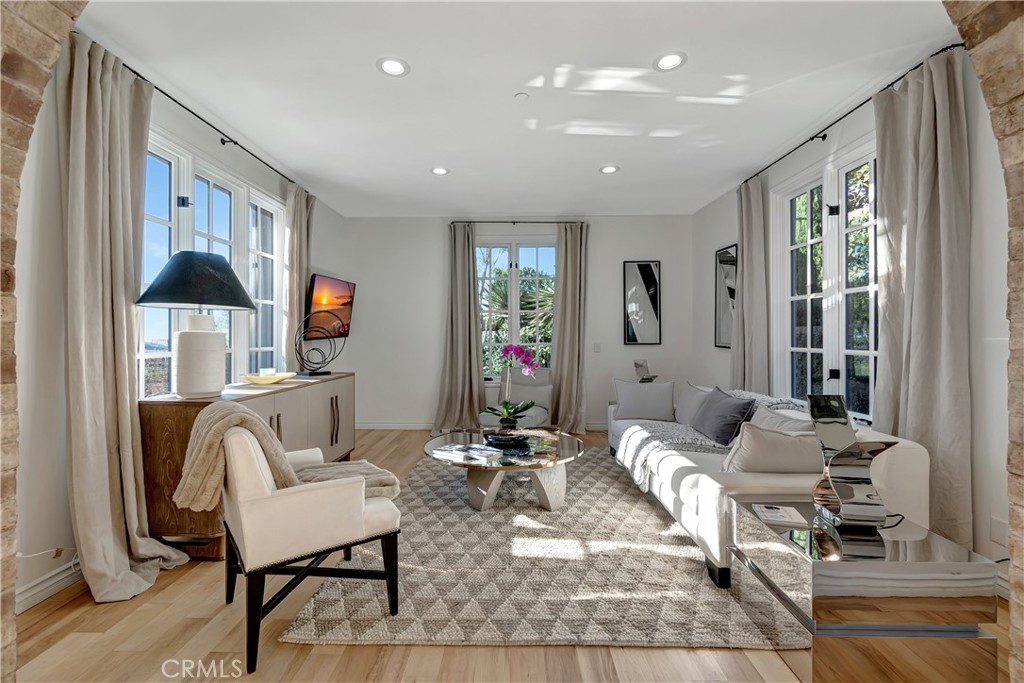 16 Eucalyptus Newport Coast, CA 92657 - Photo 9 of 38 a living room with furniture and a flat screen tv