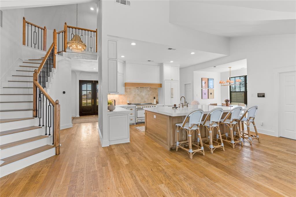 990 Cornelius Road Rockwall, TX 75087 - Photo 1 of 37 a large kitchen with a table and chairs