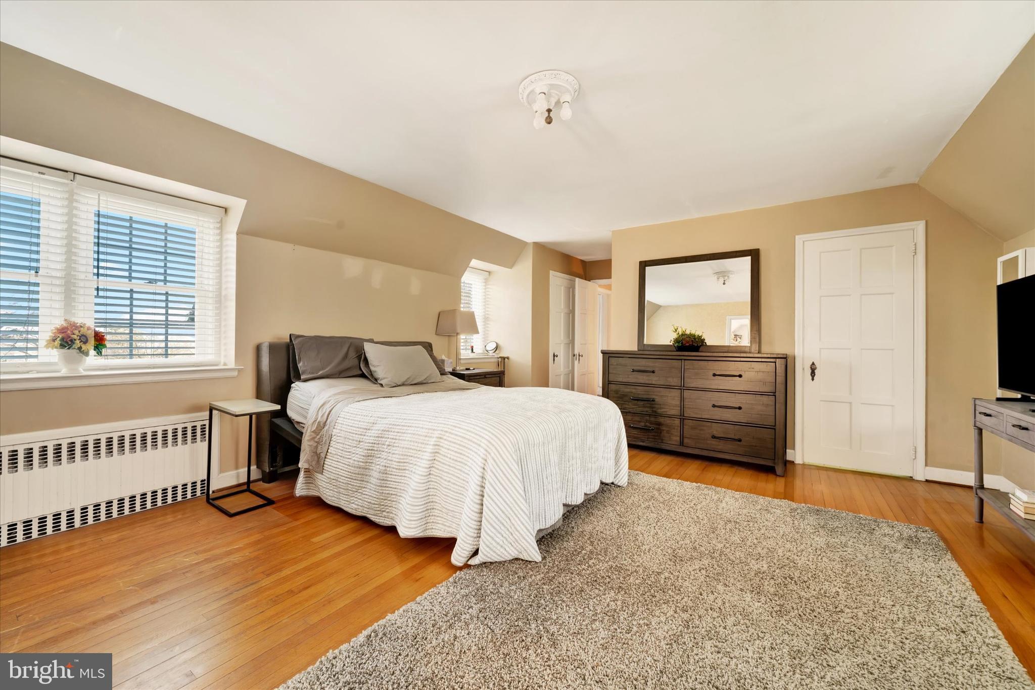 1711 Alsace Road Reading, PA 19604 - Photo 20 of 45 a spacious bedroom with a bed and a dresser